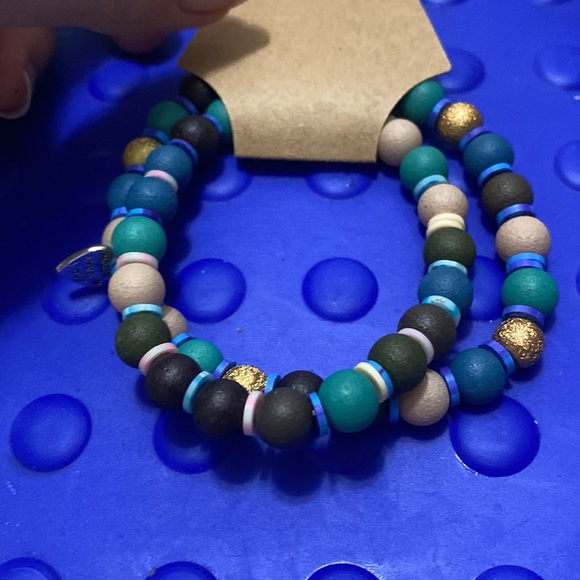Set of 2 bracelets with wooden beads &clay, spacers,&charm 6 1/2 in water proof - Picture 4 of 4